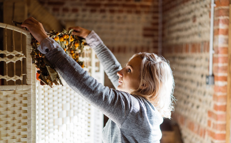 Carla setting up decorations for a rustic children's party